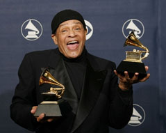 Al Jarreau holding grammy awards