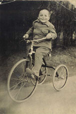 E. L. Doctorow riding a bike as a child