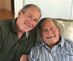 George H. W. Bush and his son, George W.