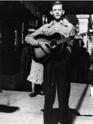 Hank Williams playing guitar