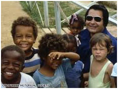 Jim Jones with his adopted children