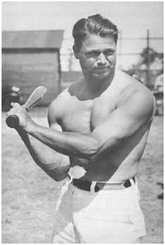 Jimmy Foxx swinging a bat with no shirt on