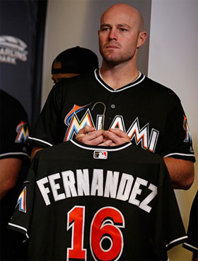 Mike Dunn holding a Jose Fernandez jersey at a press conference