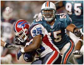 Junior Seau playing for the dolphins