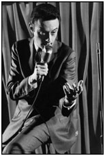 Lenny Bruce performing on stage