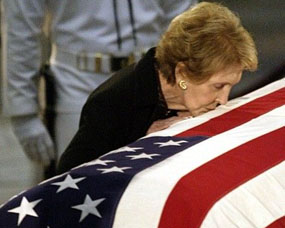 Nancy Reagan kissing Ronald Reagan's casket