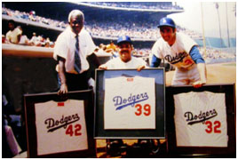 jackie Robinson, Roy Campanella lighting, and Sandy Koufax retired numbers