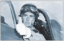 Ted Williams sitting in the cockpit of a military plane