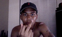 Trayvon Martin holding up middle finger