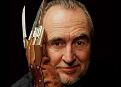 Wes Craven with freddie krueger hand