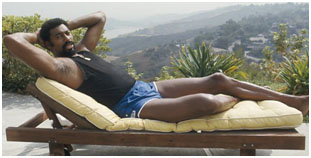 Wilt Chamberlain on a lounge chair